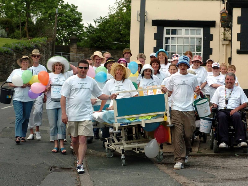 Nag's Head landlady Gillian Smyth is in bed as regulars pressed forward with a sponsored bed push to raise money for the YEP's Buy A Bed for St Gemma's Hospice Appeal in May 2005.