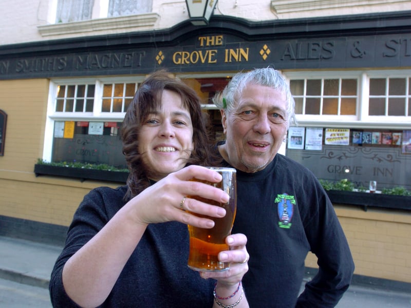 The Grove Inn landlady Rachel Scordos and manager John Rowe with a southern pint of beer served as part of the Ales Around the Aire Beer Festival. Pictured in December 2004.