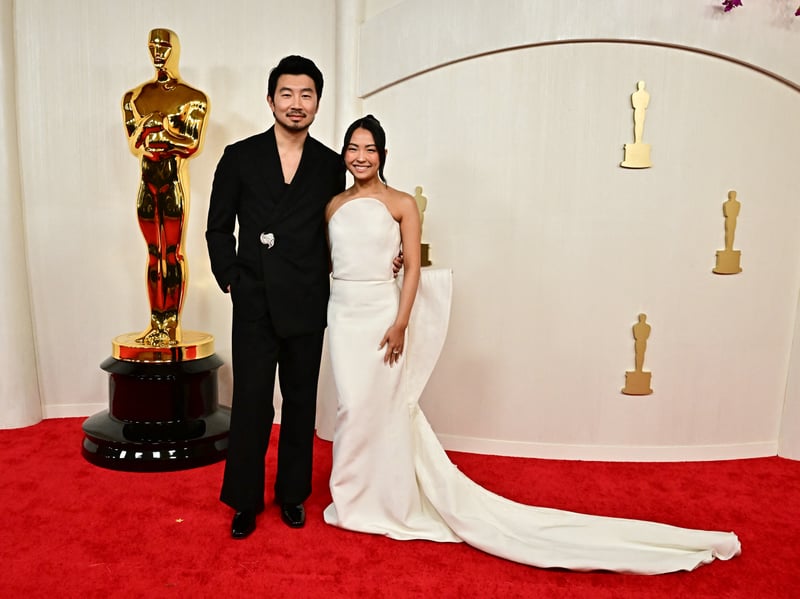 Canadian actor Simu Liu and Allison Hsu attend the 96th Annual Academy Awards. 