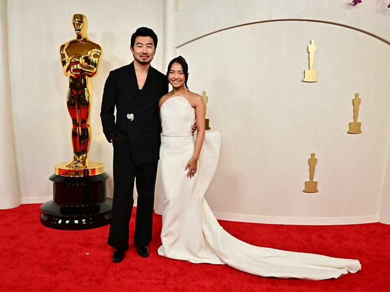 Canadian actor Simu Liu and Allison Hsu attend the 96th Annual Academy Awards.