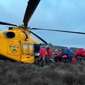 A man is loaded into an air ambulance after a 10m horror fall in the Peak District, before being flown to Northern General Hospital, Sheffield. Picture: Edale Mountain Rescue