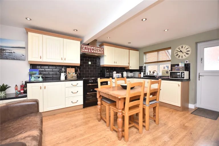 The dining kitchen is ideal for entertaining friends and family and has a range of fitted wall and base units.