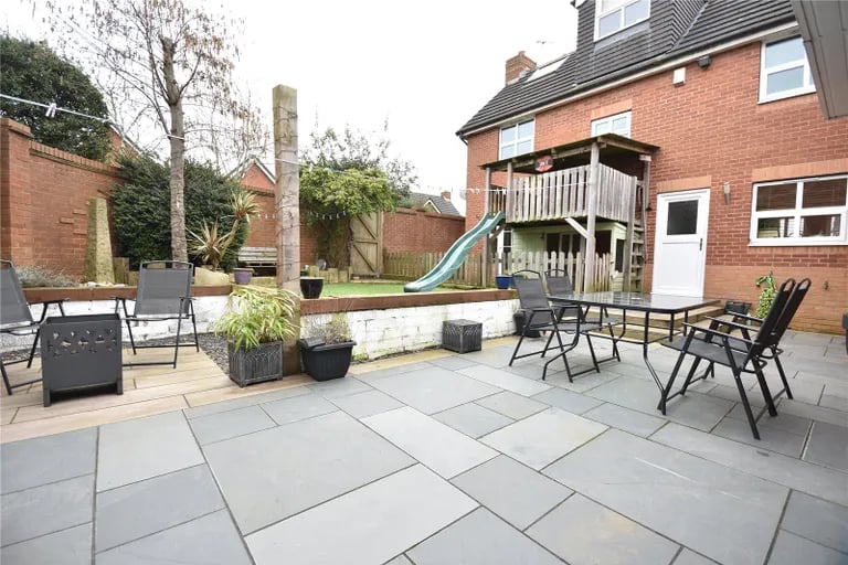 Garden parties are best held at this large patio seating area.