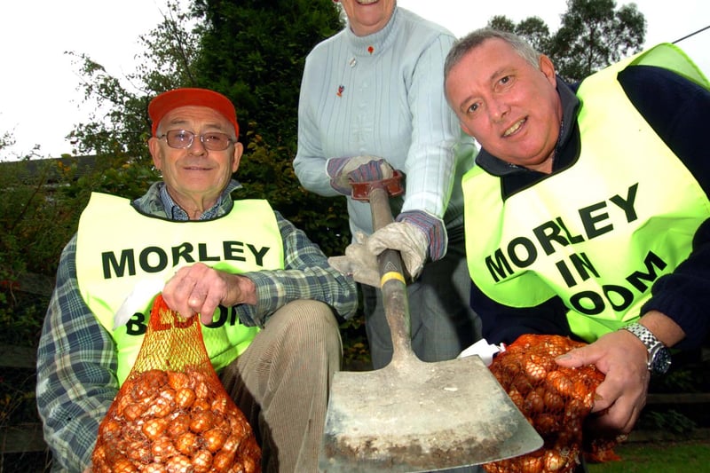 Coun Judith Elliott planting bulbs on Rein Road  with Morley in Bloom volunteers Reg Woodward, left, and Ian Knight in October 2007.