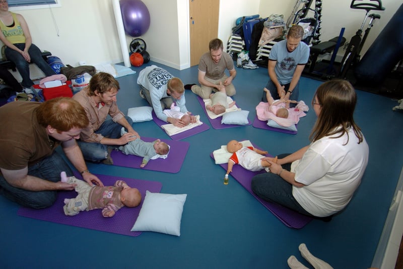 Charlotte Harrison leads baby massage class for dads at Fusion Gym in October 2007.
