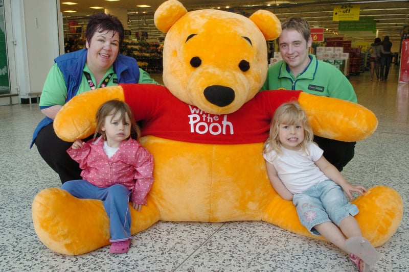 A giant Pooh bear visited Asda's Morley store in July 2007. Pictured are Michelle Bird, events co-Ordinator and Gary Wilson, greeter with young shoppers Amelia Benn and Alez Dadson. 