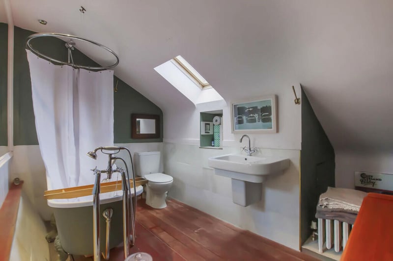 You'll find the three-piece bathroom with over-bath shower on the upper floor. 
