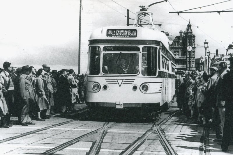 The inaugural journey of Coronation 304 on June 16th 1952, with Walter Luff in the cab instructing the Mayor how to operate the controls as it moves over the crossover through the crowd