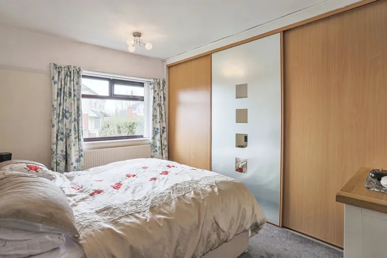It features integrated wardrobes and window to the front.