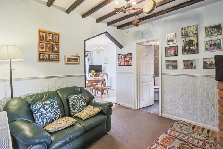 The snug acts as a second reception room in the centre of the home.