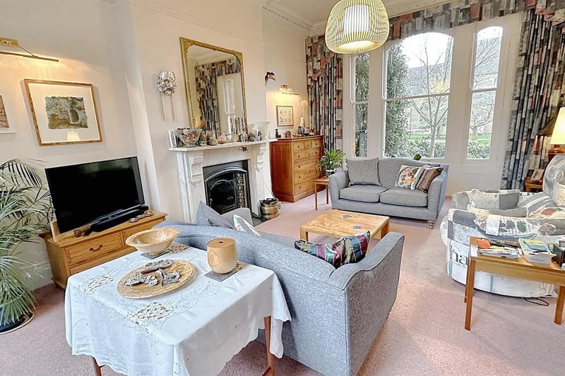 The front living room has superb wooden framed double glazed sash bay window to the front, ornate cornice, decorative ceiling rose with suspended multiple lamp fitting
