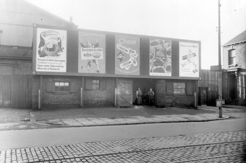 Two men can be seen in the entrance to the blacksmith's shop and forge on Hunslet Road. It was a business belonging to the Wright Brothers shoeing smiths.
