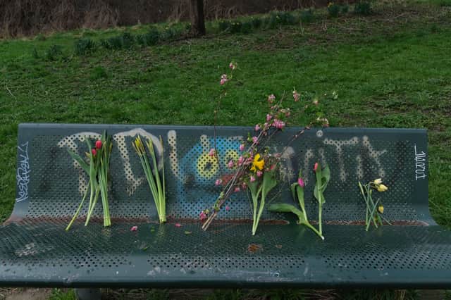 Flowers left on a bench at the Ponderosa in Sheffield