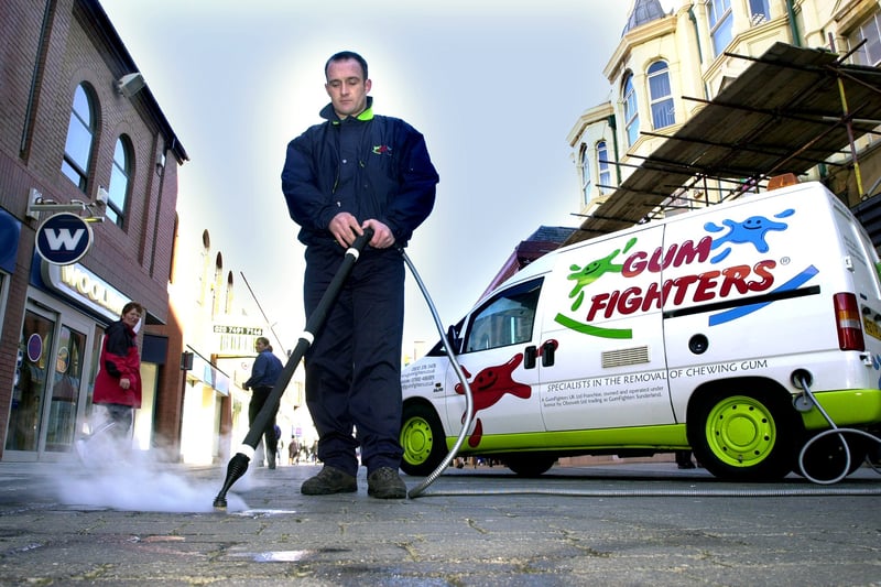 Simon Tucker of Gum Fighters clearing Victoria Street of chewing gum.
