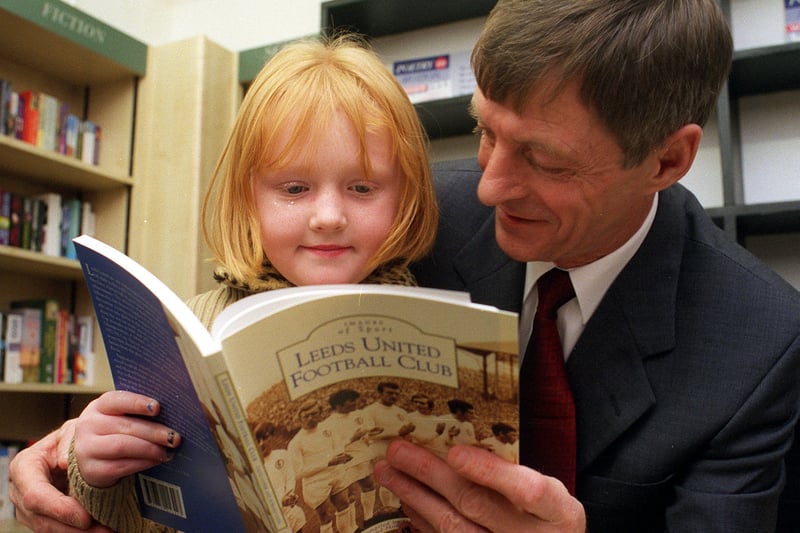 Former striker Allan Clarke reads from a new Leeds United book with young Bethany Patrick at Philip Howard Books on Street Lane in November 1999.