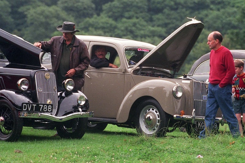 A classic car parade was staged from Roundhay Park to Harewood House in August 1999. Pictured are owners checking their cars before setting off on the journey.