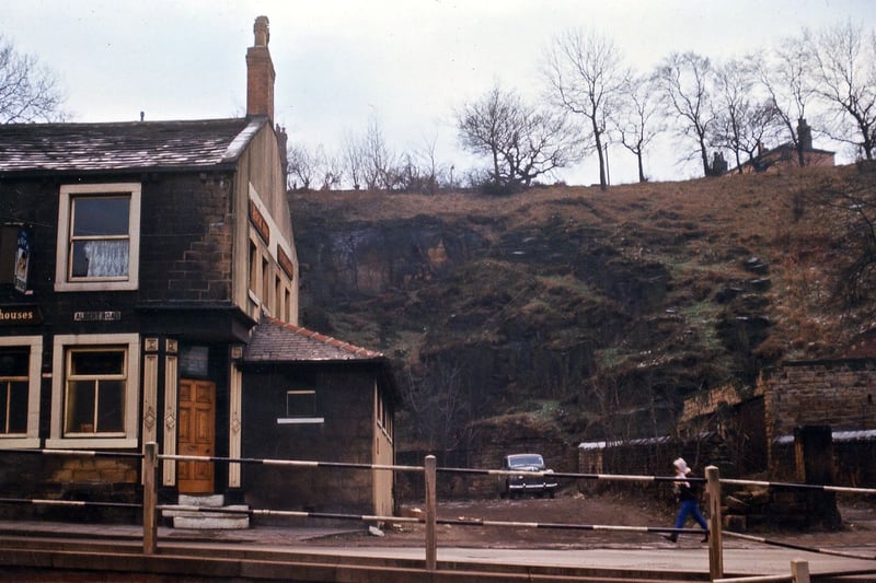 A view of the end of the row on Albert Road which accommodates the Rock Inn, so called because of the steep rock face behind it, between Station/Albert Road and Troy Road, above which was Morley's first quarry. The spot where the car is parked was the site of the pinder's cottage. Pictured in January 1965.