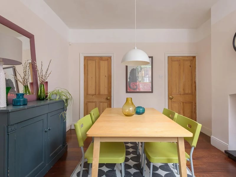 The kitchen is on the other side of this bright, spacious dining room.