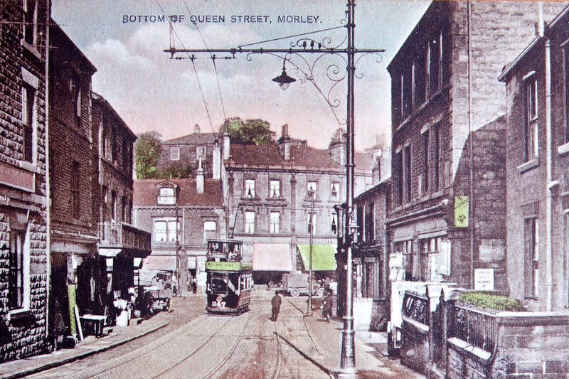 The bottom of Scatcherd Hill, Queen Street, Morley, with tramcar no. 247 just turning the corner to go up Chapel Hill, in the mid to late 1920s. The taller block in behind the tram is called Cheapside and dates from 1895, with the Conservative Club up Chapel Hill at the end of that row dating from 1899. This was built on the site of the Old Malt Shovel Inn.