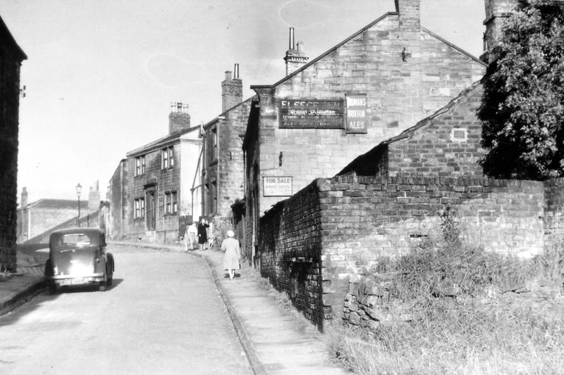  Troy Road showing the last part of the bend around the churchyard of St. Mary's-in-the-Wood. The Fleece Inn is shown gable end on with dwelling houses further along. It was in a slum clearance area in the late 1950s. 