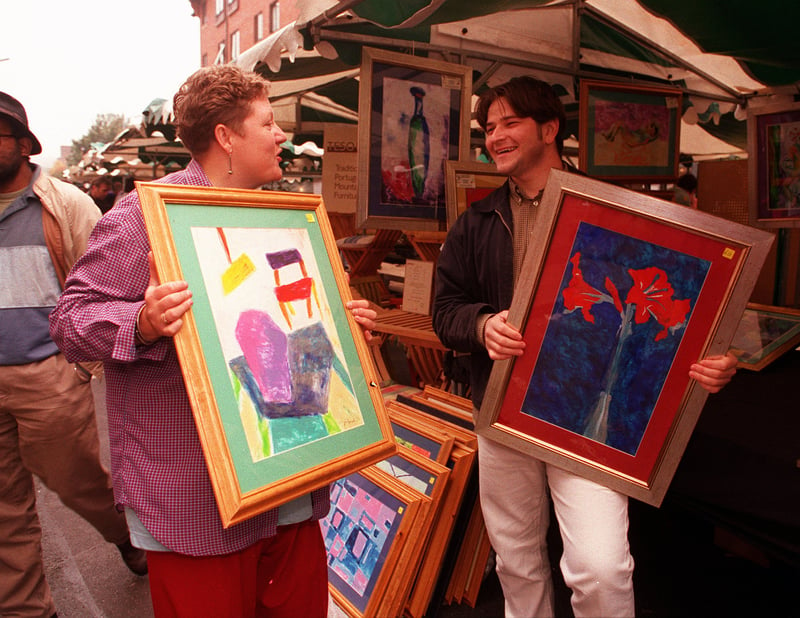 Artist Donna Jones selling one of her paintings to Richard Ibbotson at the Devonshire Green street market