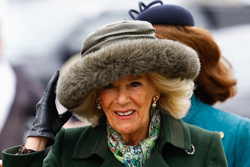 Britain's Queen Camilla arrives to attend the second day of the Cheltenham Festival at Cheltenham Racecourse, in Cheltenham, western England on March 13, 2024. (Photo by Ben Stansall / AFP) (Photo by BEN STANSALL/AFP via Getty Images)