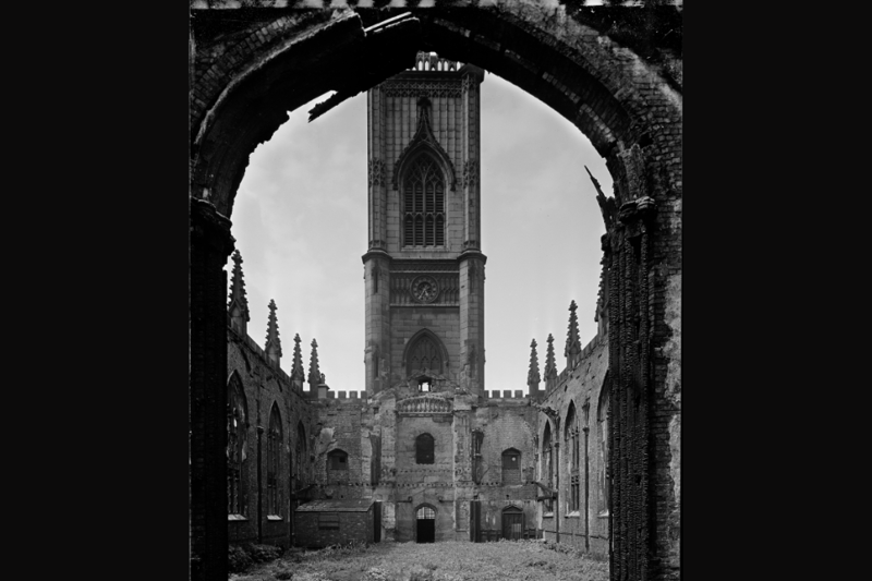 A 1963 view from beneath the chancel arch looking west towards the tower in the ruins of St Luke's Church, which was bombed during the Blitz in 1941. The walls and tower, minus the roof, were been retained as a memorial to those killed during the war.