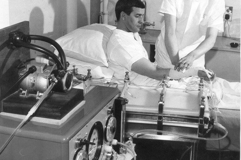 An "artificial kidney" at Edinburgh Royal Infirmary, April 1966.  "Technicians show how the machine is connected to the kidney patient.  An operation has to be performed on an artery to allow it to remain open. In this way the kidney machine can be used constantly." 
