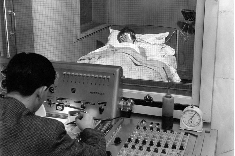 Sleep monitoring at the Royal Edinburgh Hospital.  Wires are taped to the volunteers head and readings are recorded on a special machine set up in an adjoining room and watched over by a doctor.  The Edinburgh research laboratory was Britain's main research centre into the causes and manifestations of sleep, when this picture was taken in August 1967.
