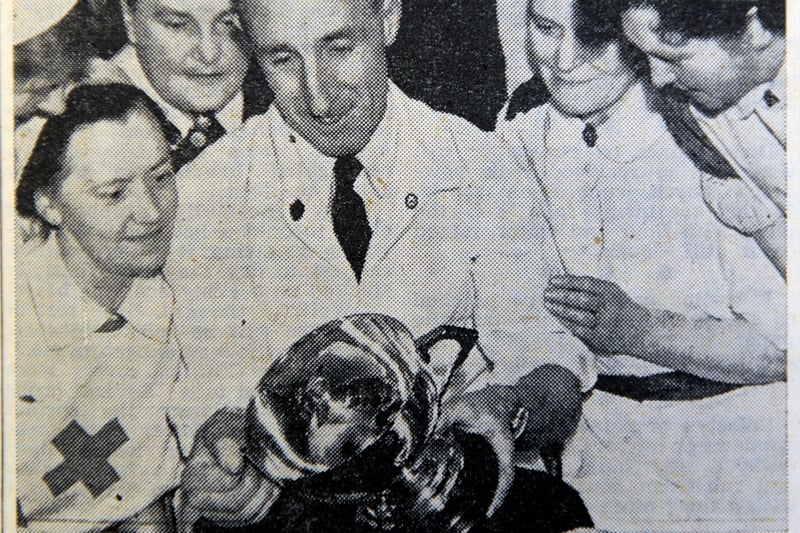Members of the team which won the National Hospital Service Reserve First Aid Units compeition with their trophy at Edinburgh's Eastern General Hospital, November 1954 