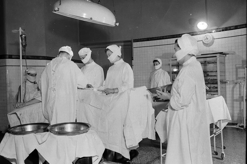 Leith Hospital operating room, Edinburgh: operation surgeons and nurses in April 1953