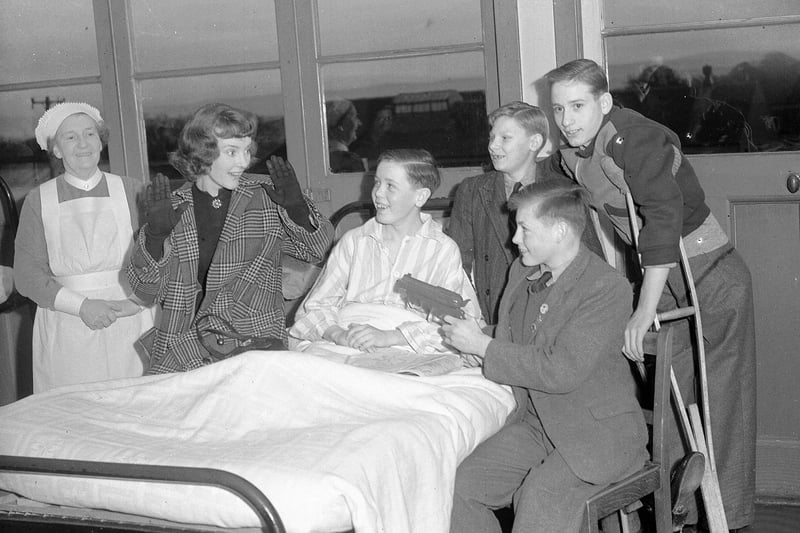 Singer Petula Clark in Edinburgh, December 1957, visiting children in hospital.