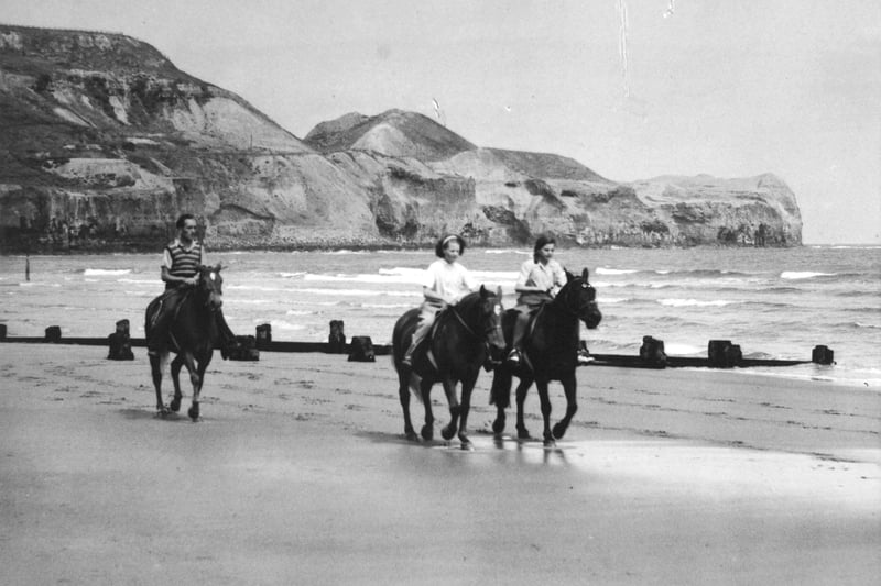 Riding along the beach in July 1949.Kettleness Point provides the backdrop.