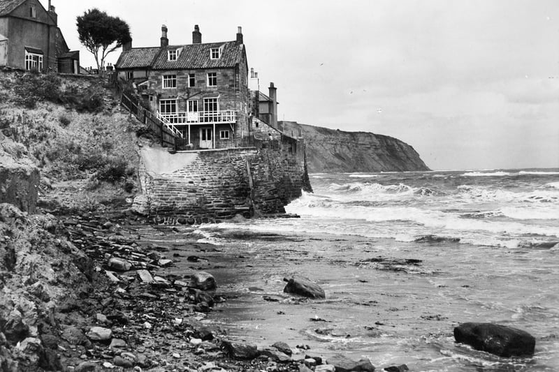 Houses threatened by coastal erosion. Pictured in July 1949.