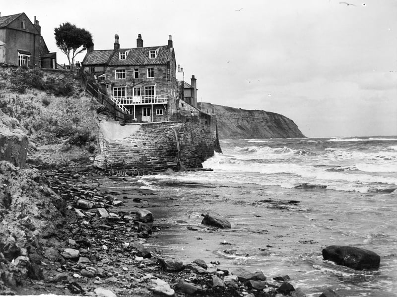 Houses threatened by coastal erosion. Pictured in July 1949.