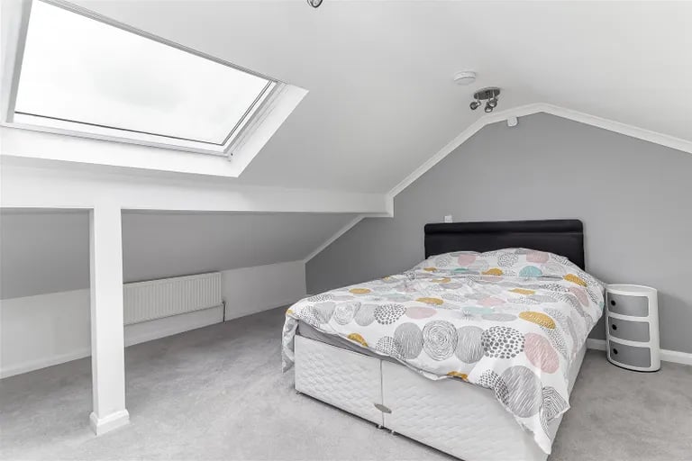 On the first floor is the master bedroom with built-in wardrobes and skylights.
