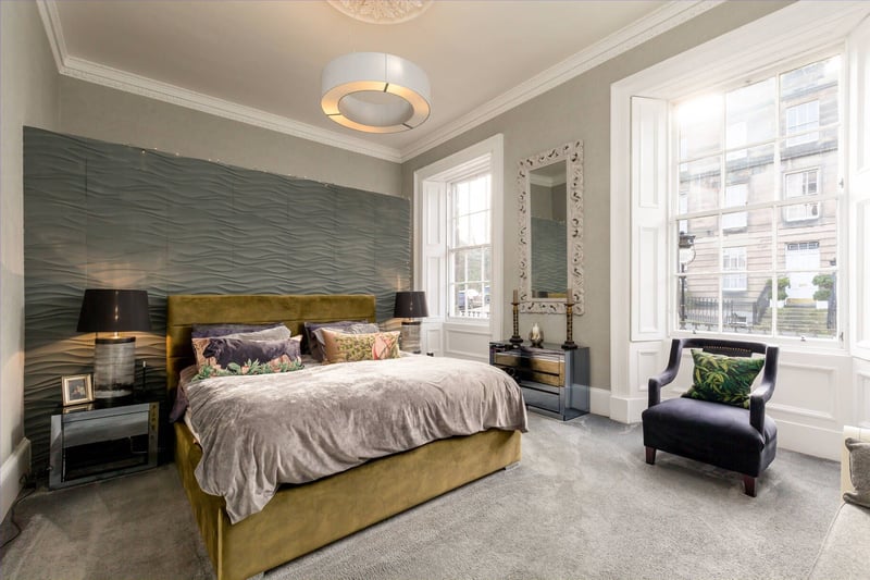 The property's rather grand master bedroom. Comfort is ensured by an effective and efficient gas central heating system coupled with the refurbished sash and case windows and operational shutters.