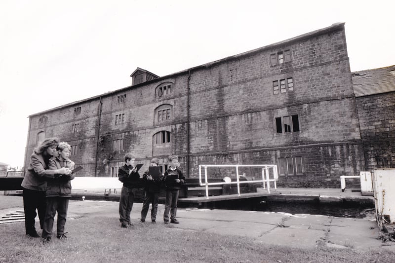 Christine Moore, a parent of a pupil at Alwoodley Primary, is pictured with youngsters from the school who visted Granary Wharf for the first of the new historic riverside walks around the backs of factories. Pictured in May 1993. 