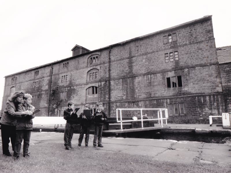 Christine Moore, a parent of a pupil at Alwoodley Primary, is pictured with youngsters from the school who visted Granary Wharf for the first of the new historic riverside walks around the backs of factories. Pictured in May 1993.