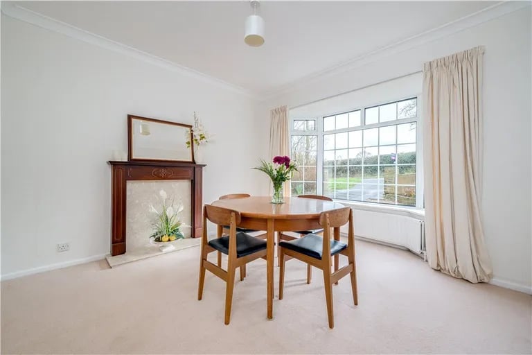 A separate dining room sits to the front with a large bay window.