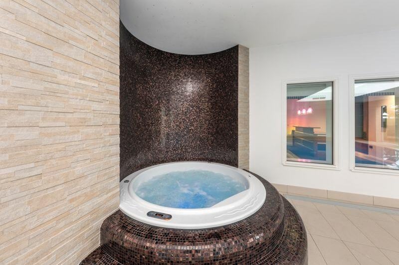 Within the property's leisure is a four to six person hot tub, complete with its own lighting and tiled surround.