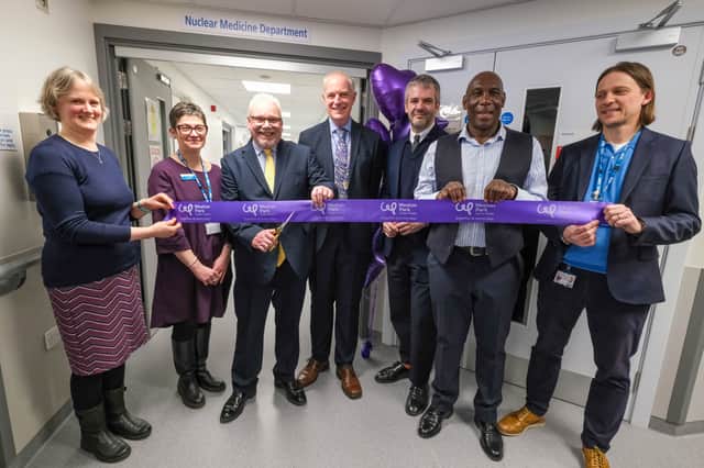 First patient Russell Dickens cuts the ribbon to the new facility (3rd from left) with Consultant Clinical Scientist Anna Hallam, Sheffield Teaching Hospitals Chief Executive Kirsten Major, South Yorkshire’s Mayor Oliver Coppard, Uriah Rennie and Technical Manager Adam Pickles.