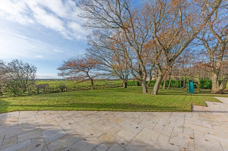 The property is situated on a plot of land which is just over 0.5 acres in size. The entire home is surrounded with greenery, making it the perfect place to relax during the summer months.