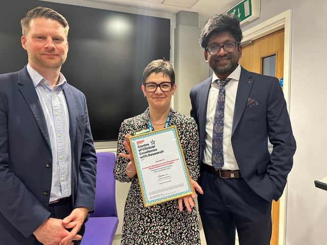 Rob Burley (Muscular Dystrophy UK), Kirsten Major (Chief Executive,
Sheffield Teaching Hospitals) and Dr Hewamadduma with their Centre of
Clinical Excellence award