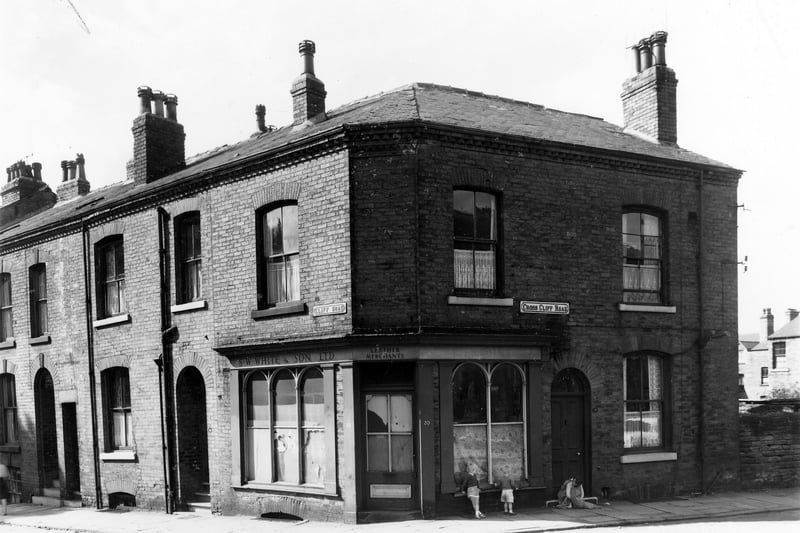 This view looks onto the junction of Cliff Road and Cross Cliff Road. On the left edge is number 17 Cliff Road is a corner property, a former shop, S.W. White and Son Ltd, leather merchants with a residence to the right opening onto Cross Cliff Road. Pictured in August 1961.