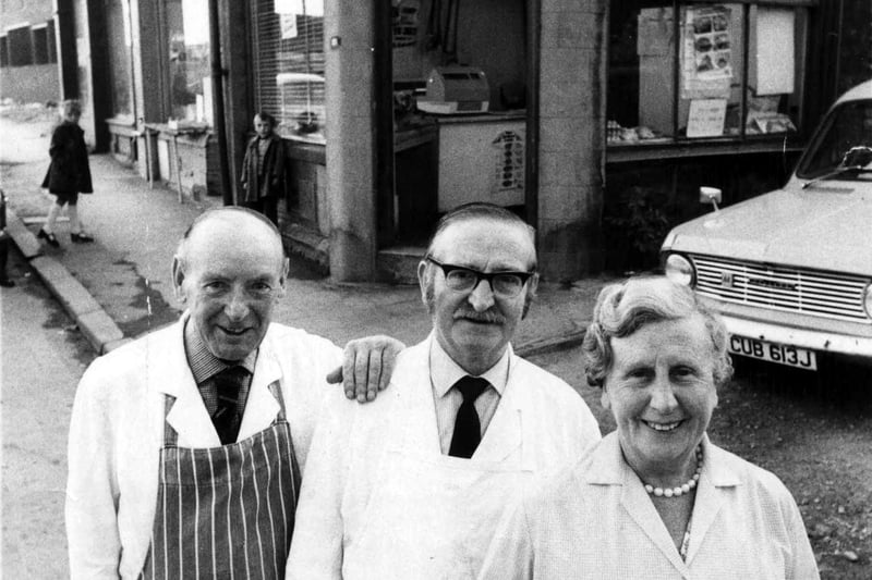Kitty Lister and her staff on the day of her retirement in July 1975 from the family butcher's business, Lister's English Meat Purveyors, on Lower Town Street, seen in the background. The shop had originally been run by her parents, Harry and Emma (nee Shaw) Lister. It was located on the corner with Farrar's Yard (right edge).