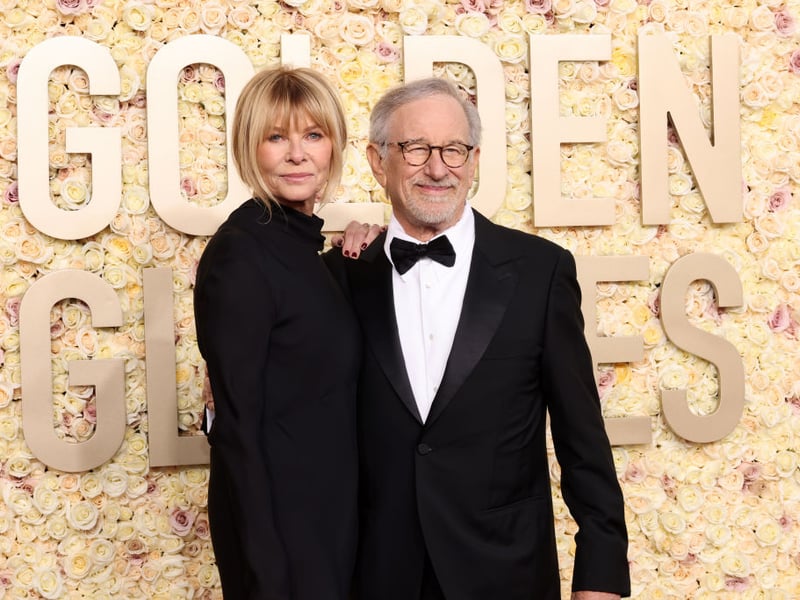 Steven Spielberg is the visionary film director responsible for films like ET: The Extraterrestrial, Jaws and Raiders of the Lost Ark. Kate Capshaw. Kate Capshaw is an actress whose screen roles include Space Camp, The Quick and the Dead and Indiana Jones and the Temple of Doom. She met her husband on the latter film and the couple married in 1991. They have an estimated worth of £3.5 billion.