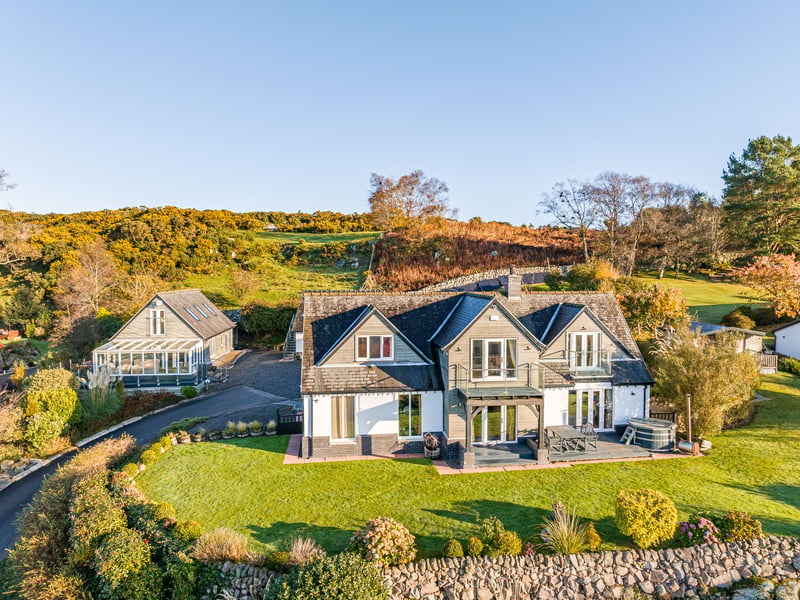 The property is priced at offers over £975,000 and is marketed by Fine and Country South Scotland.