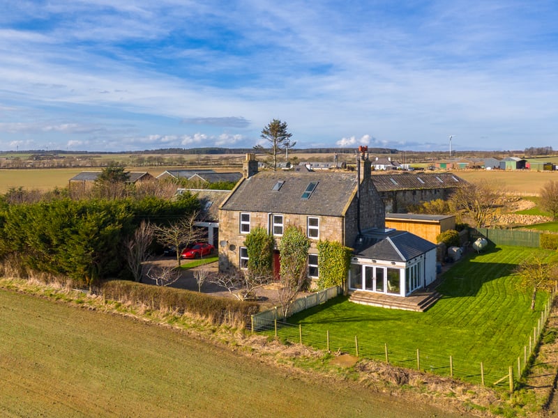 The six-bedroom home sits within an enclosed 0.54-acre garden.