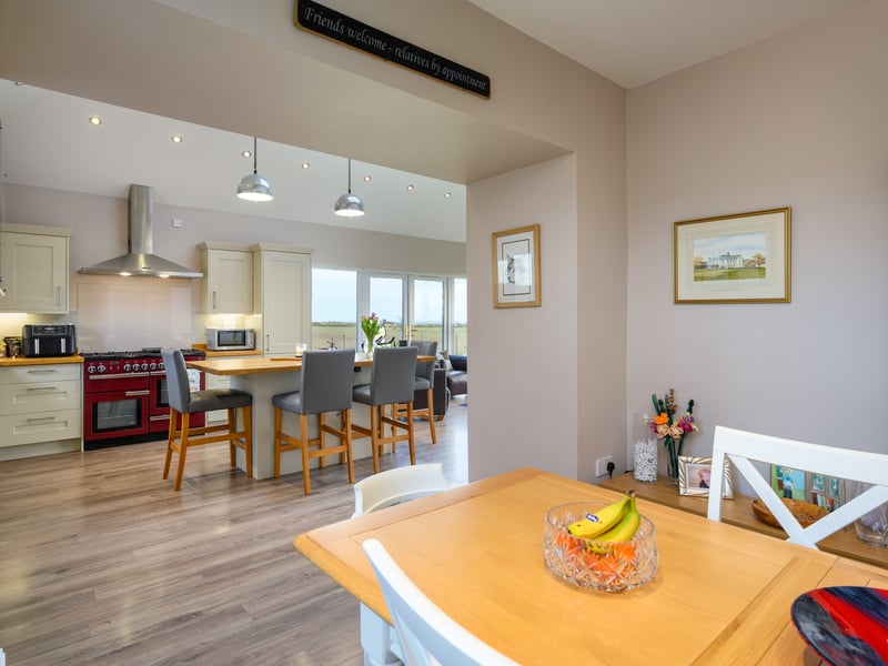 A new kitchen extension has been added and includes a Rangemaker cooker and a generously sized island unit.
